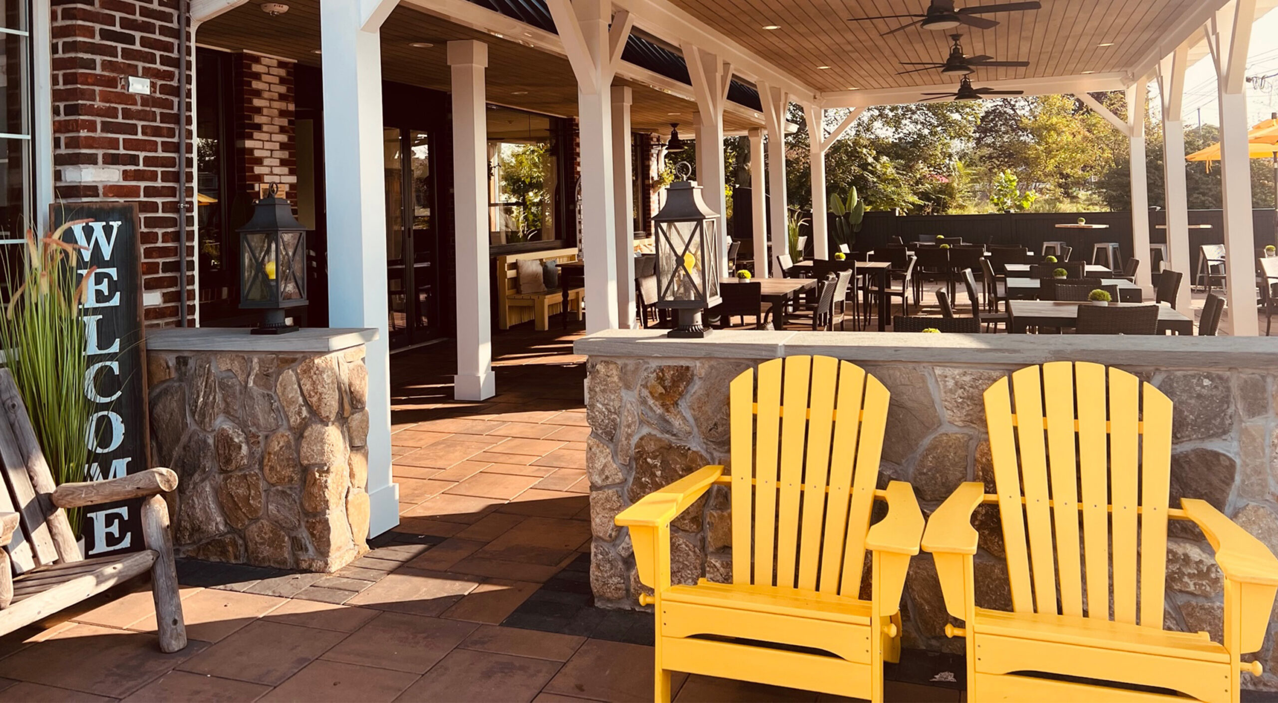 Yellow Adirondack chairs on the patio at Chip's Family Restaurant in Orange