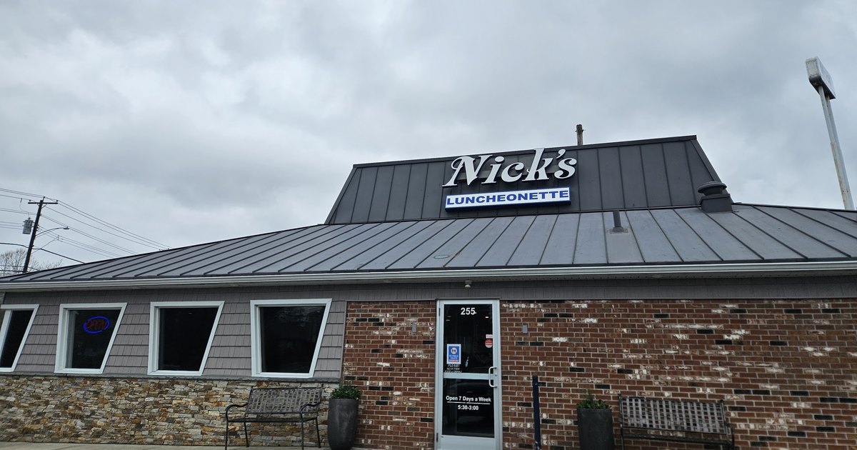 The Nick's Luncheonette sign above the brick front entrance at 255 Saw Mill Road in West Haven