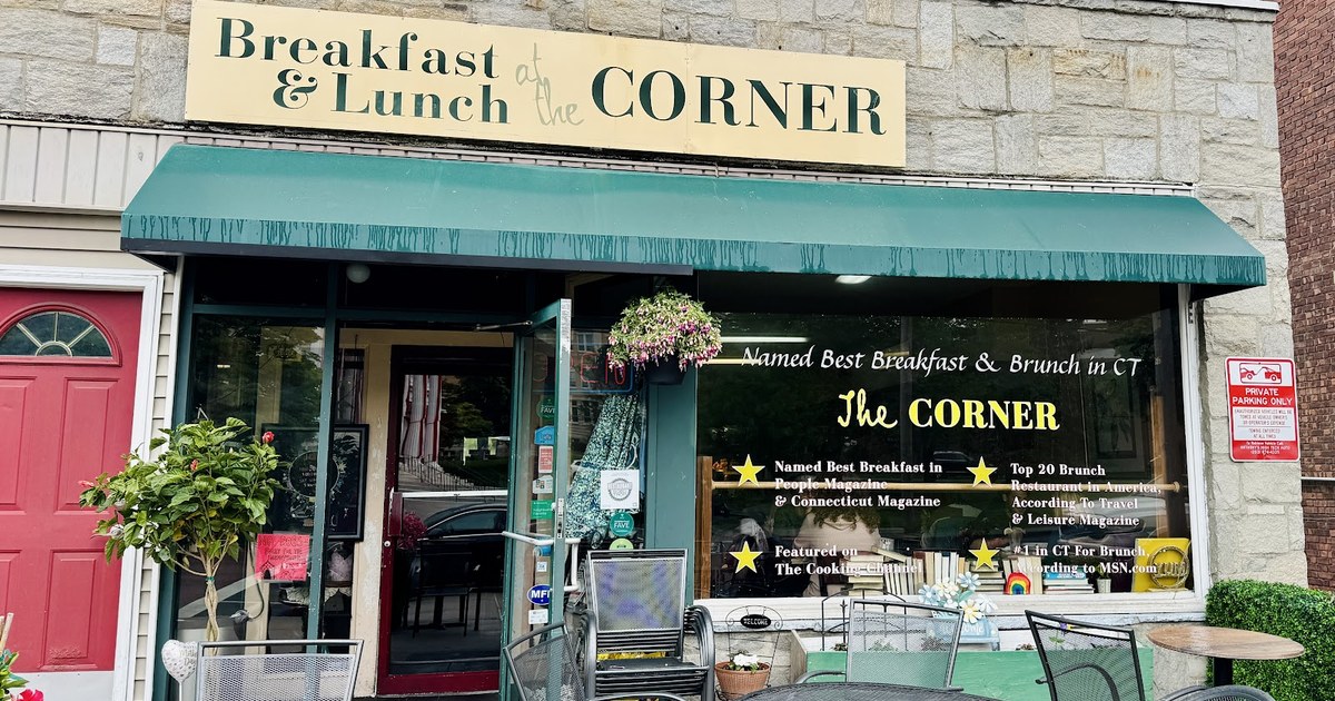 The Corner restaurant's green awning and Breakfast & Lunch sign at 105 River Street in downtown Milford